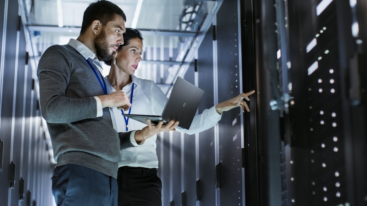 Woman and man having a conversation in the server room