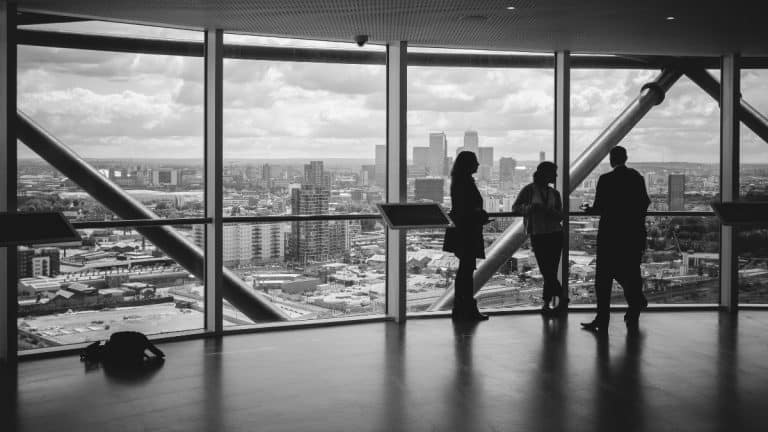 A meeting near transparent glass against the backdrop of a skyline