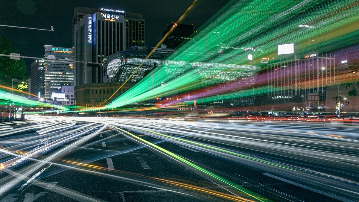 5G Advanced: A city street filled with lots of green lights at night